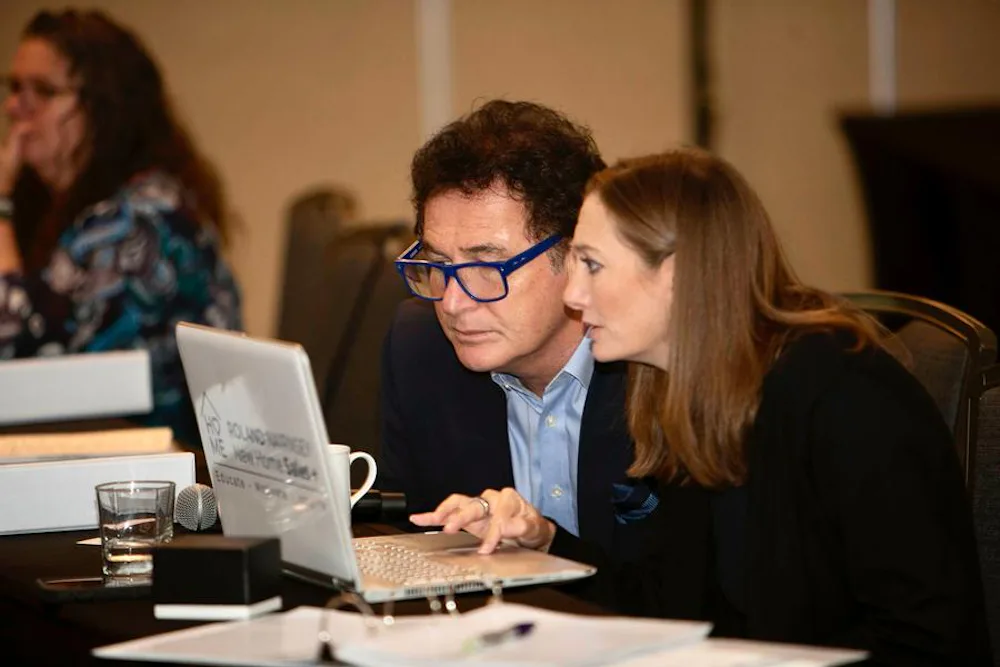 Abi helping Roland plan powerpoints